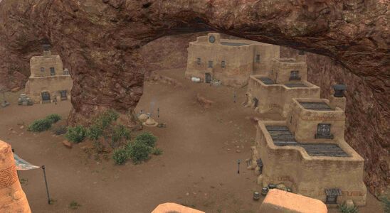 The village is partially hidden within a cave